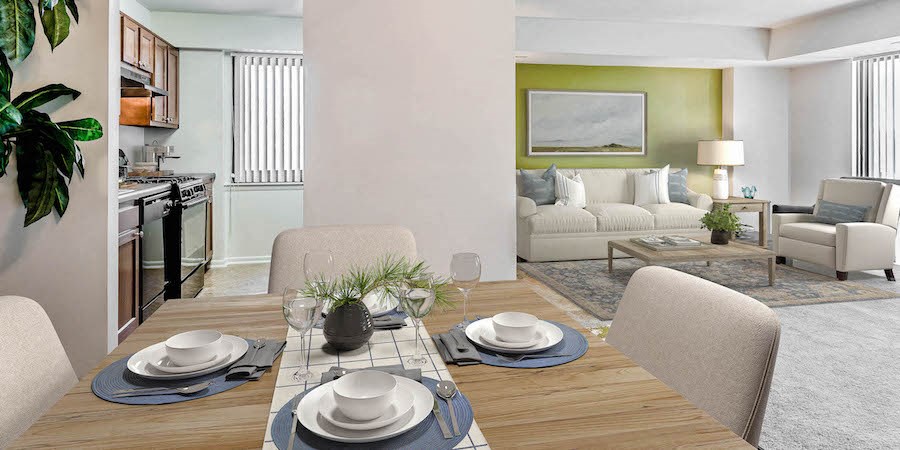 a living room and dining room with a table and chairs