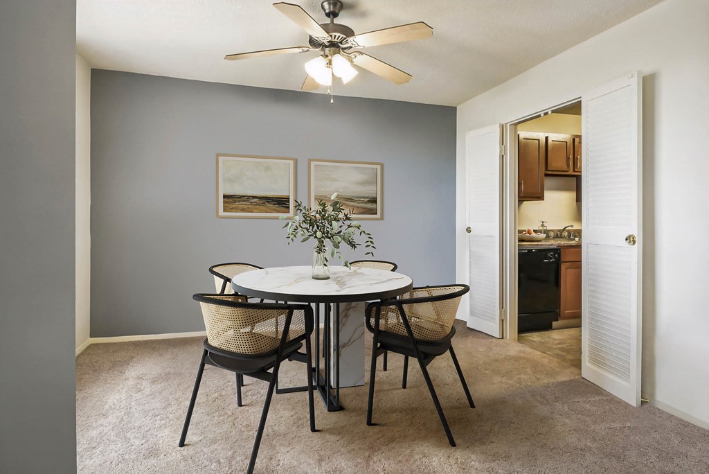 a dining room with a table and chairs