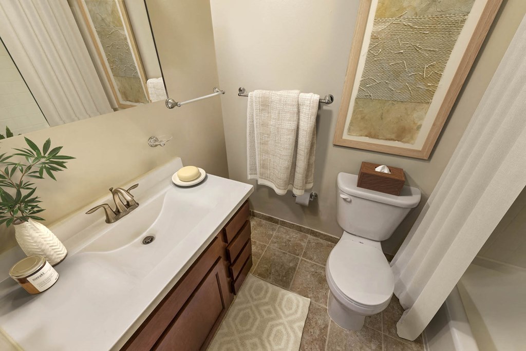 a bathroom with a toilet and a sink