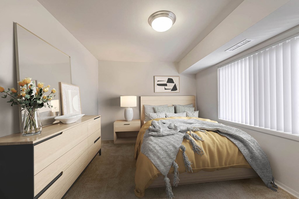 a bedroom with a bed and a dresser