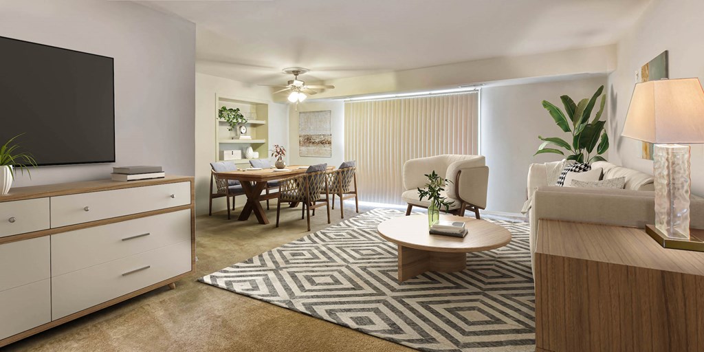 a living room and dining room with a couch and a table