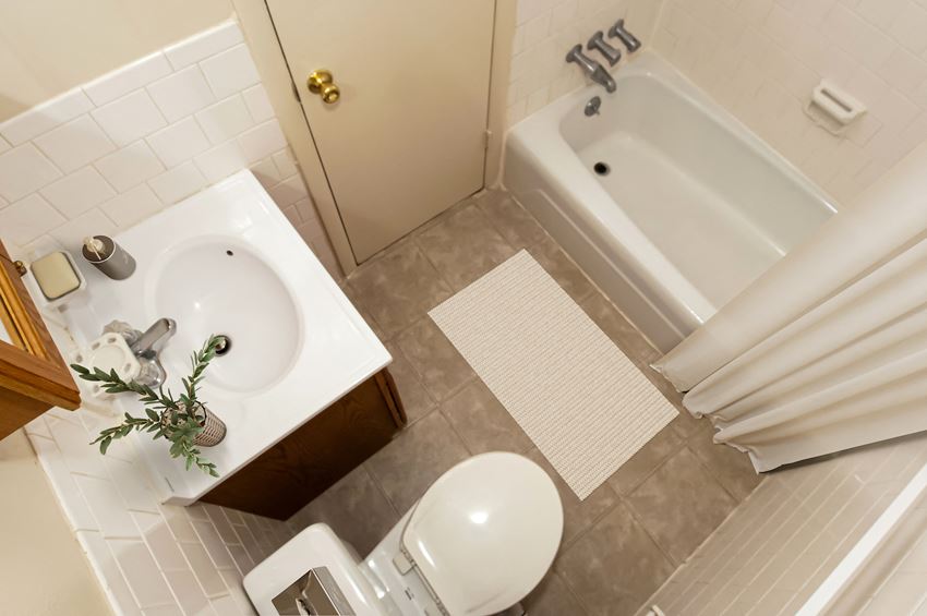 a bathroom with a sink toilet and a bath tub