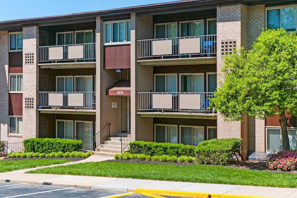 an apartment building with stairs and balconies