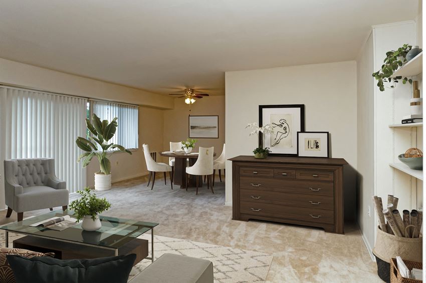 a living room and dining room with a table and chairs