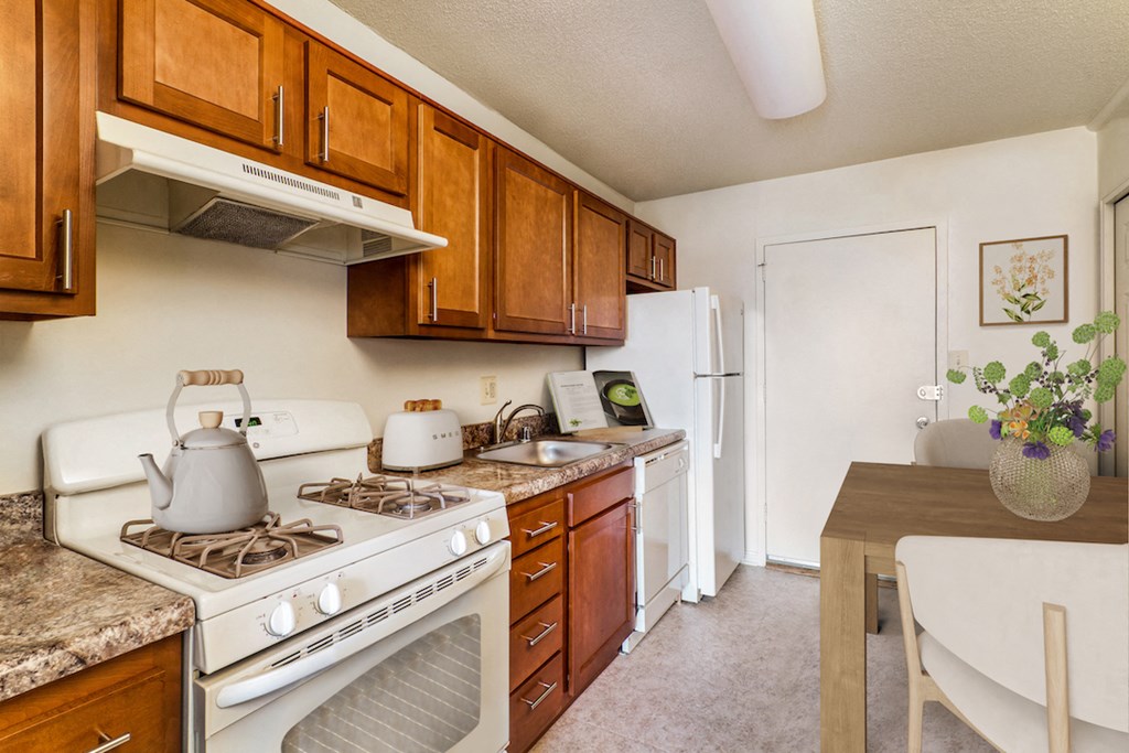 a kitchen with white appliances and wooden cabinets and a table