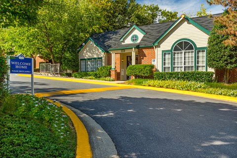 a house with a welcome home sign in front of it