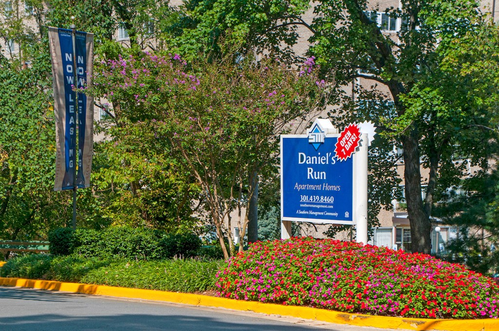 a sign for the dance run in front of a building