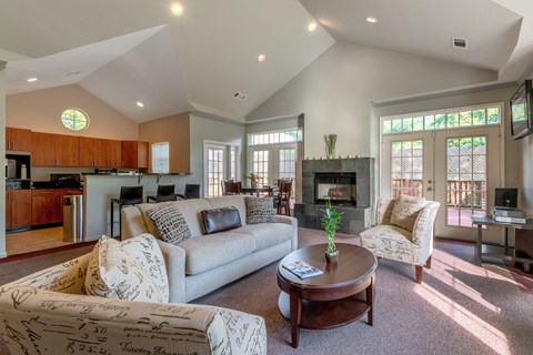 a living room with couches and a coffee table