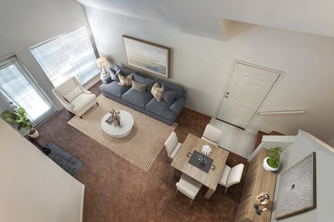 an aerial view of a living room and dining room from above