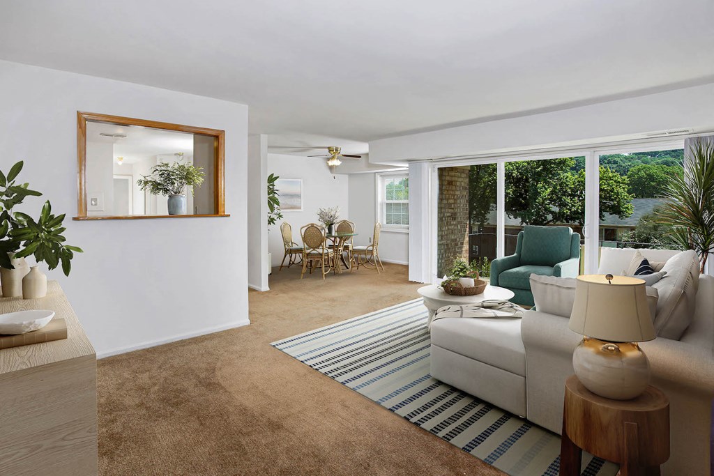 a living room with a white couch and a rug
