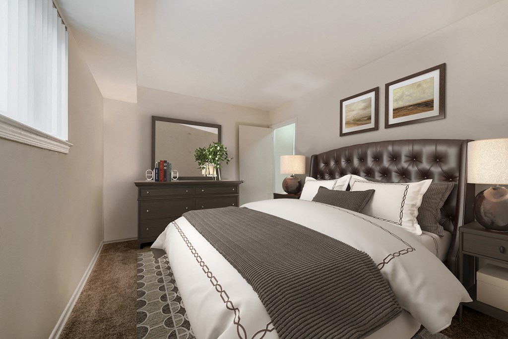 a bedroom with a bed and a dresser and a window