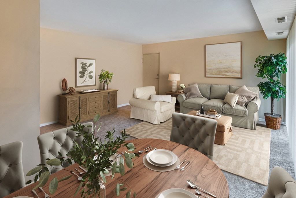 a living room and dining room with a table and chairs