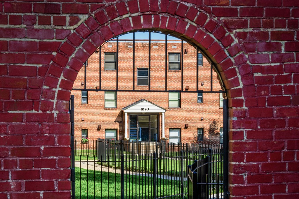 a red brick building with an arched door