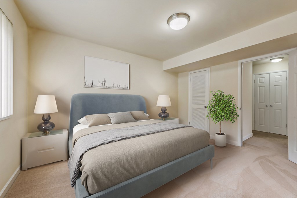 a bedroom with a bed and a plant