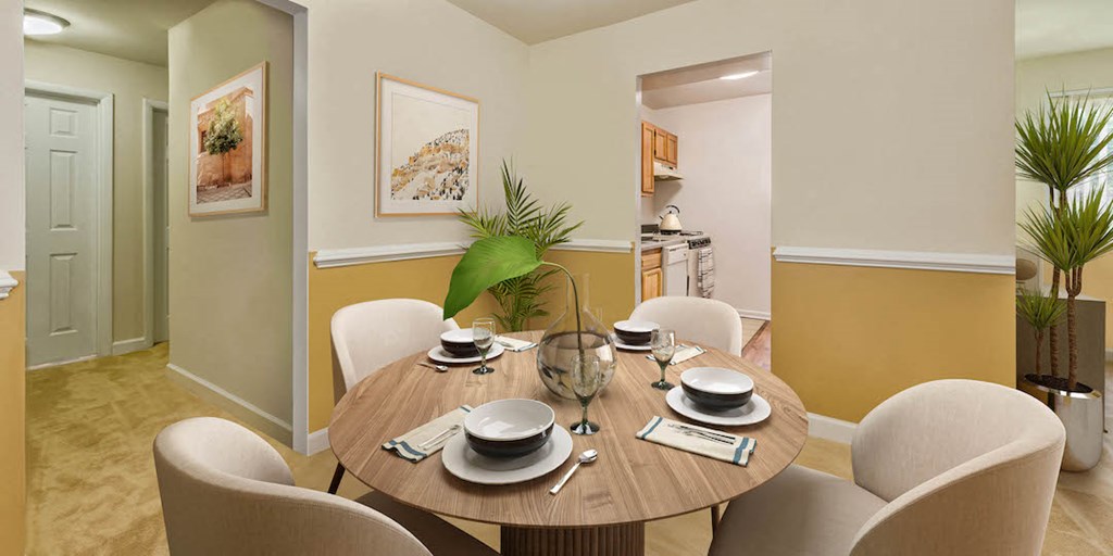 a dining room with a table and chairs