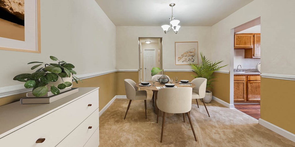 a dining room with a table and chairs