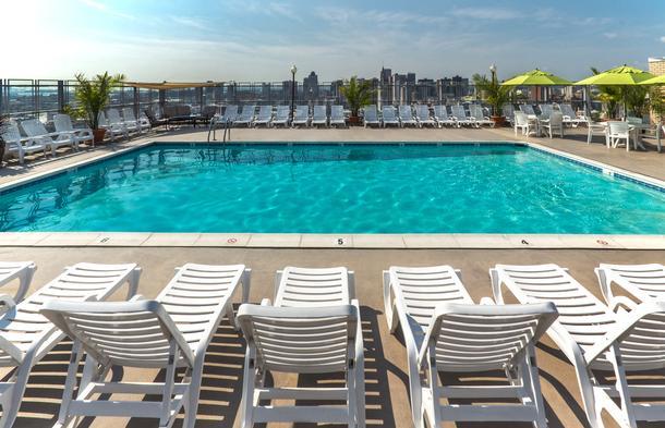 a group of chairs around a pool
