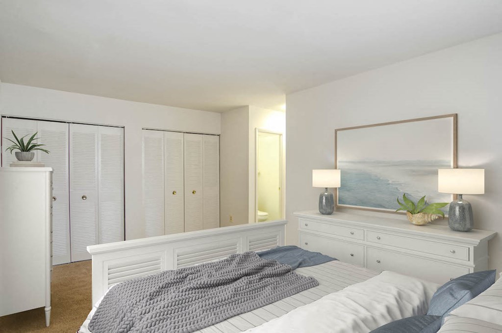 a bedroom with a bed and a painting on the wall