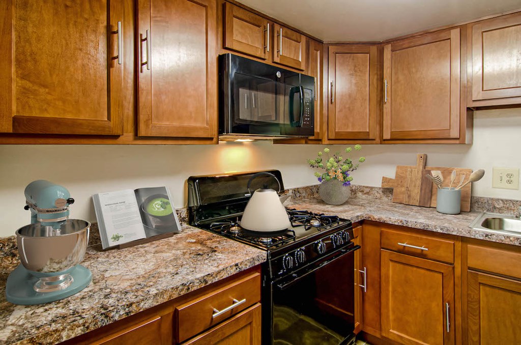 a kitchen with a stove and a microwave