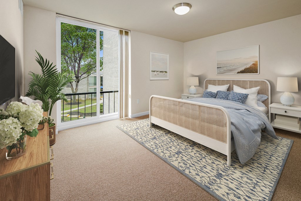 a bedroom with a bed and a large window