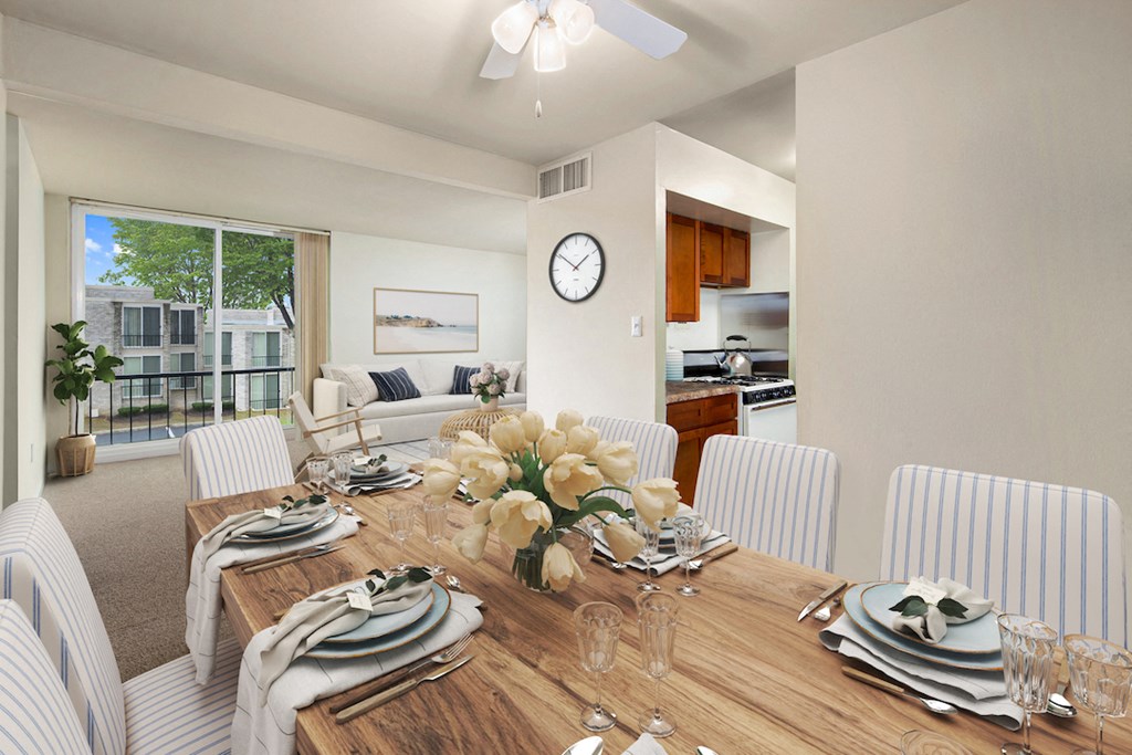 a dining room with a wooden table and chairs