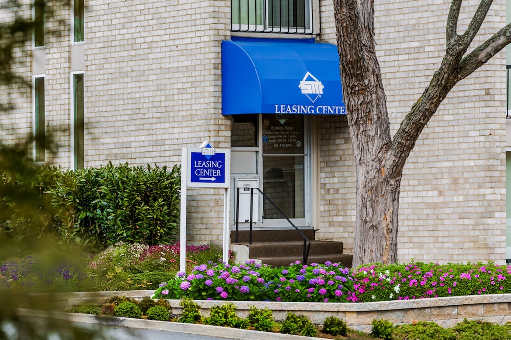 a building with a leasing center sign on the side of it