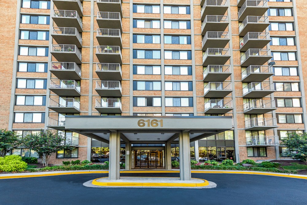 an apartment building with a entrance with the number 661 on it