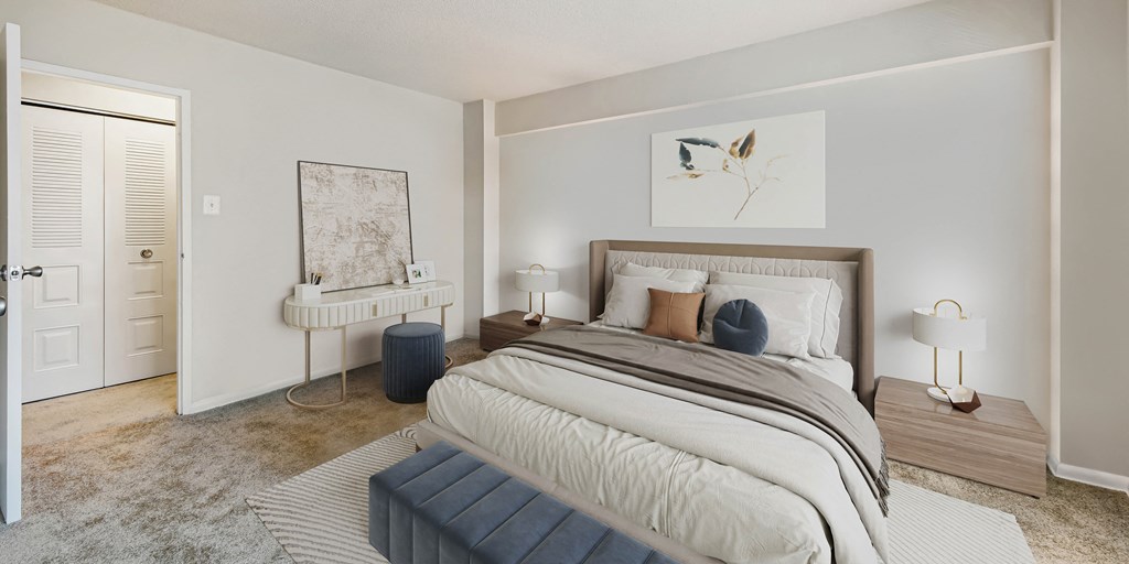 a bedroom with a large bed and a closet