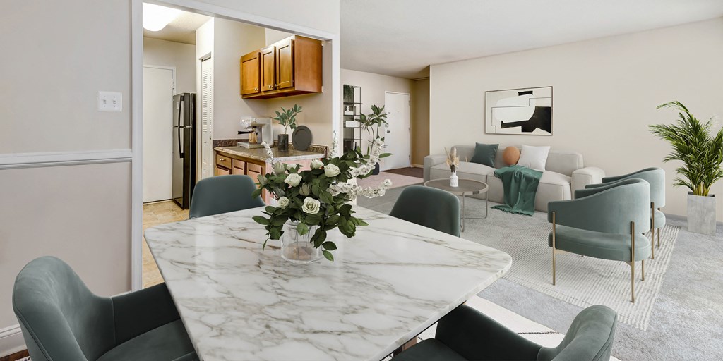a living room and dining room with a marble table and chairs