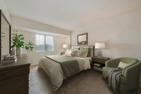 a bedroom with a bed and a chair and a dresser