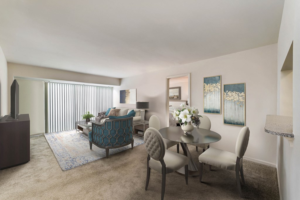 a living room with a table and chairs and a couch