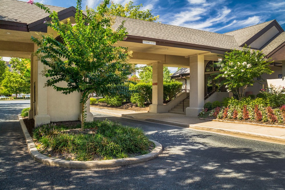 a building with a tree in front of it