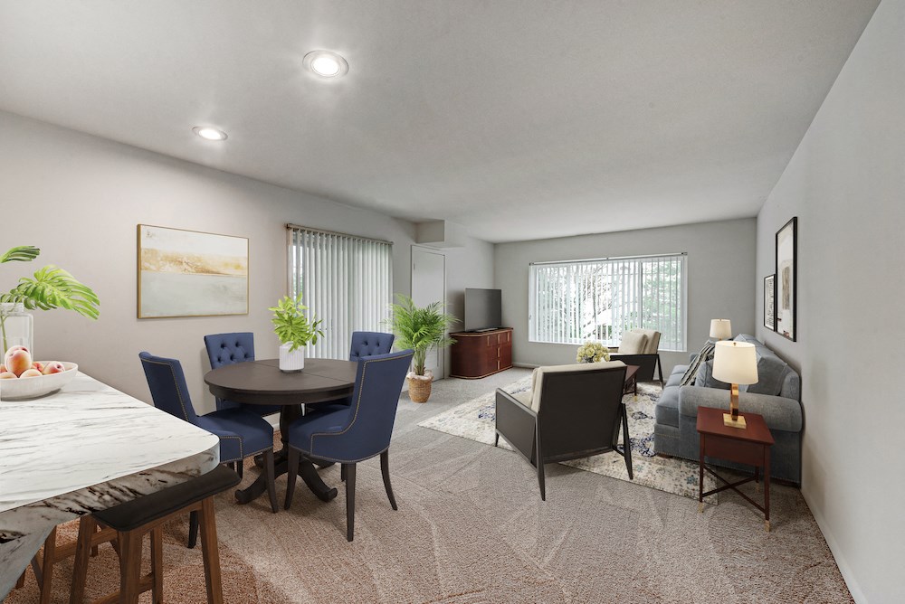 an open living room and dining room with a table and chairs