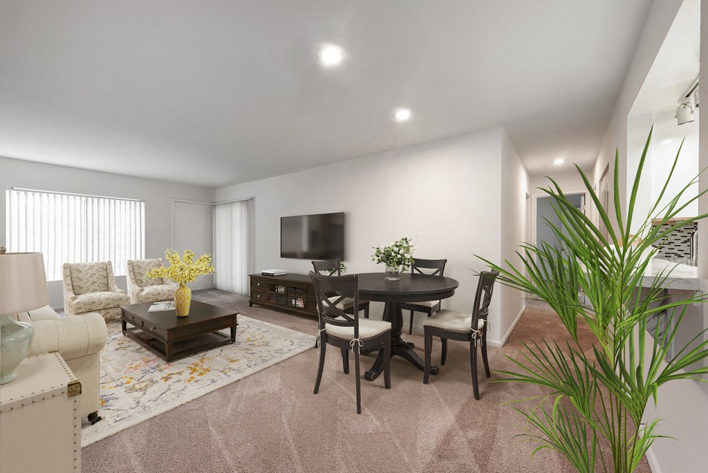 a living room with a table and chairs and a television