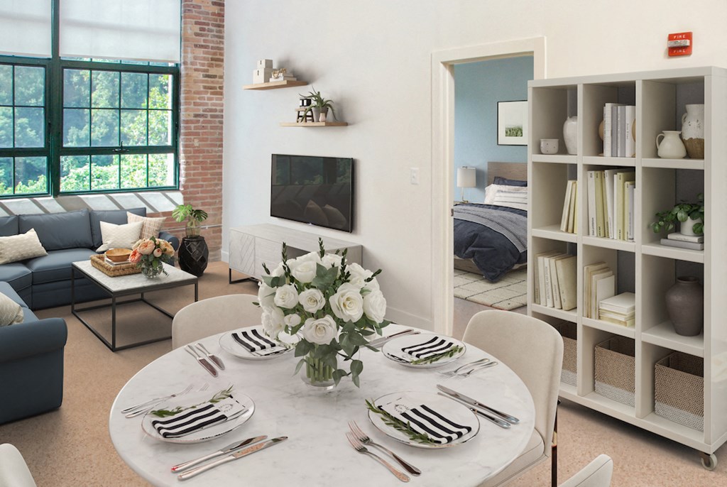 a living room with a table and a couch and a tv