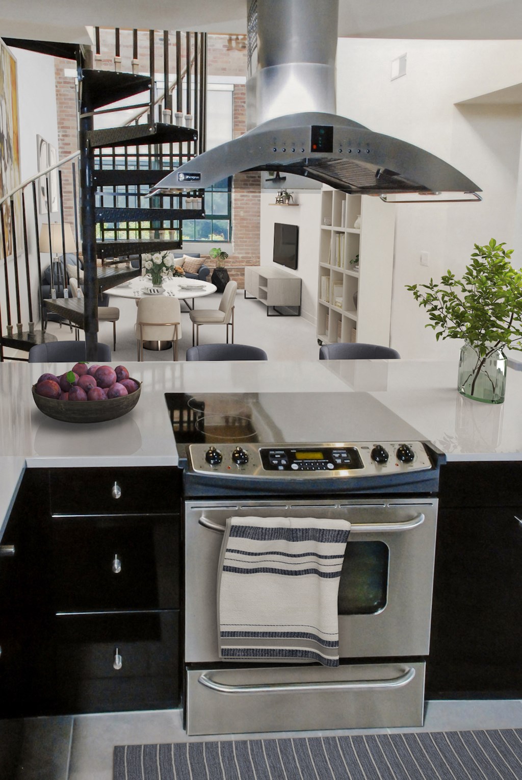a kitchen with a stainless steel stove and an island with a bowl of fruit