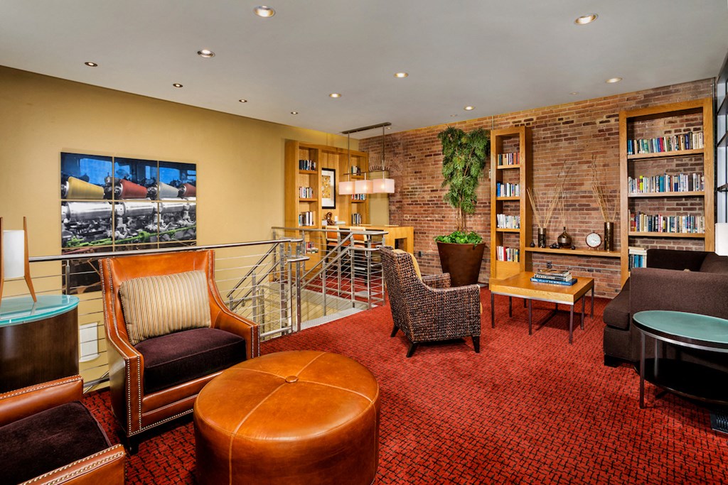 a living room filled with furniture and a tv