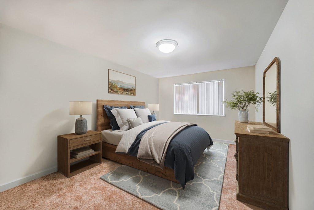 a bedroom with a bed and a dresser and a window