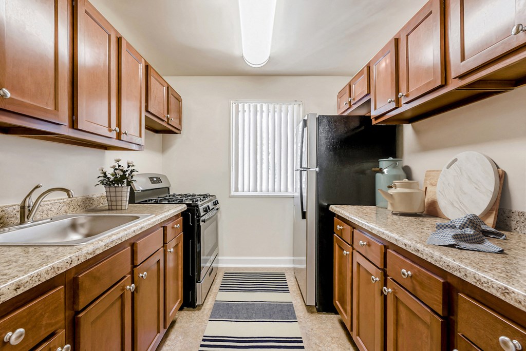 a kitchen with a sink and a refrigerator