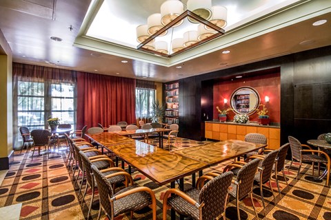 a conference room with a long wooden table and chairs