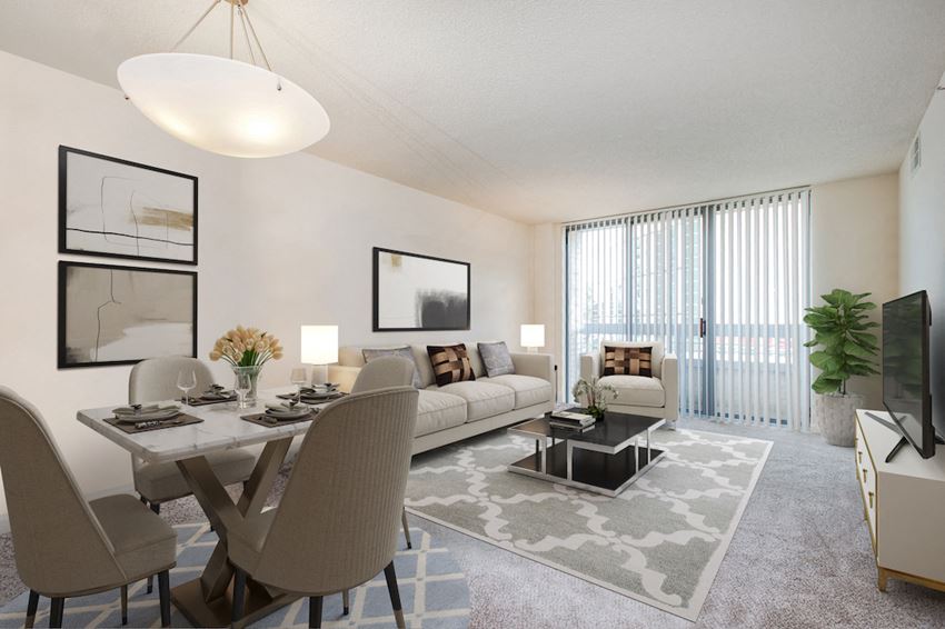 the living room of an apartment with a dining table and a couch