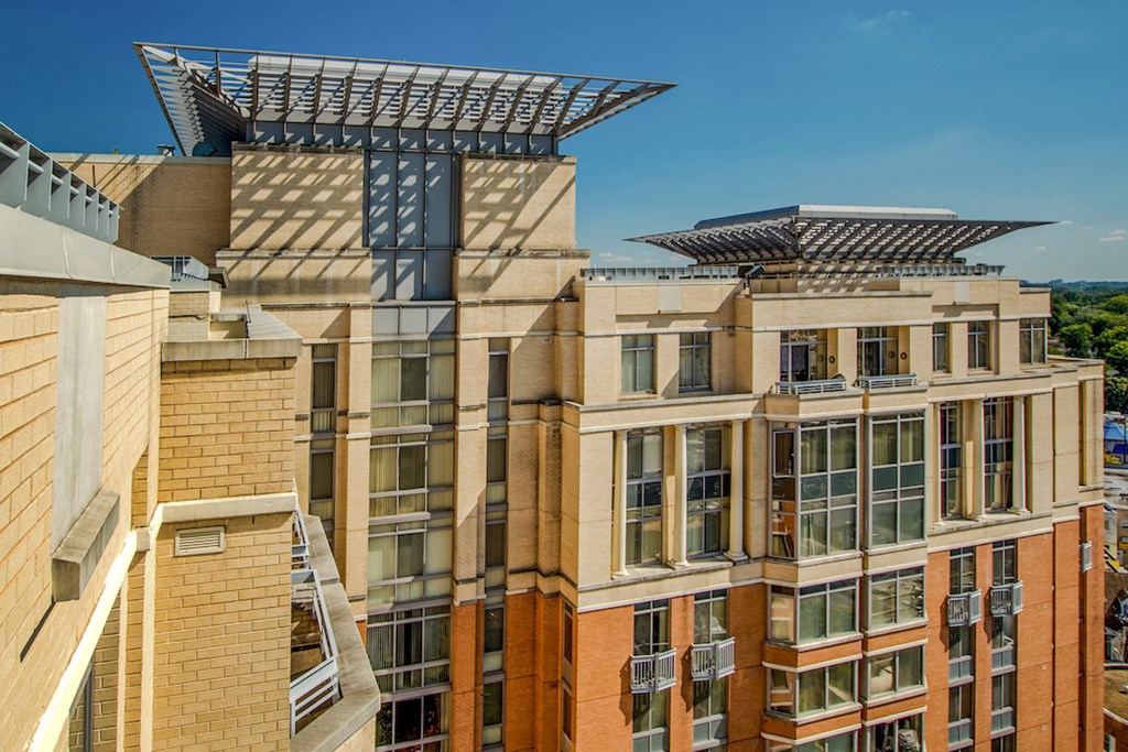 an aerial view of a building with a large structure on top of it