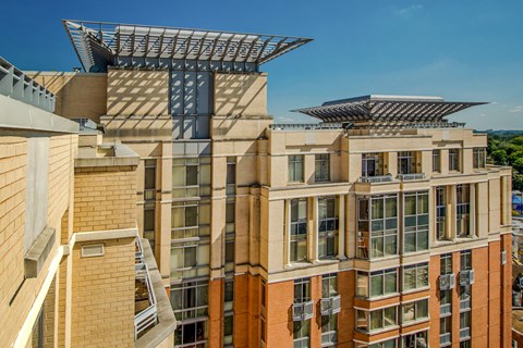 an aerial view of a building with a large structure on top of it