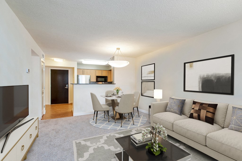 a living room and dining room with a couch and a table