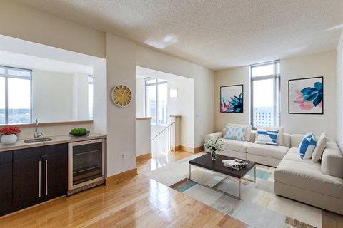 a living room with a white couch and a coffee table