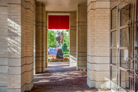 a statue of a person on a statue pedestal in the middle of a building