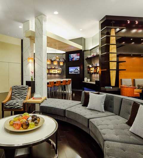 a living room with a couch and a table with a plate of food