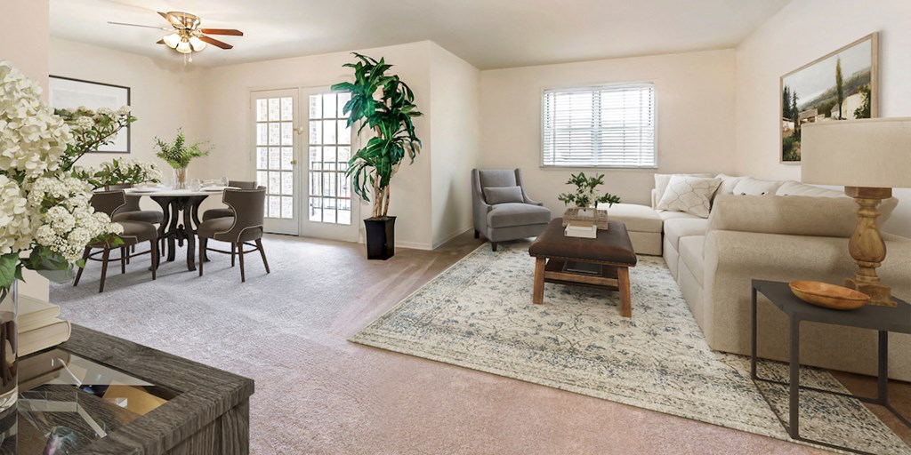 a living room and dining room with a couch and a table