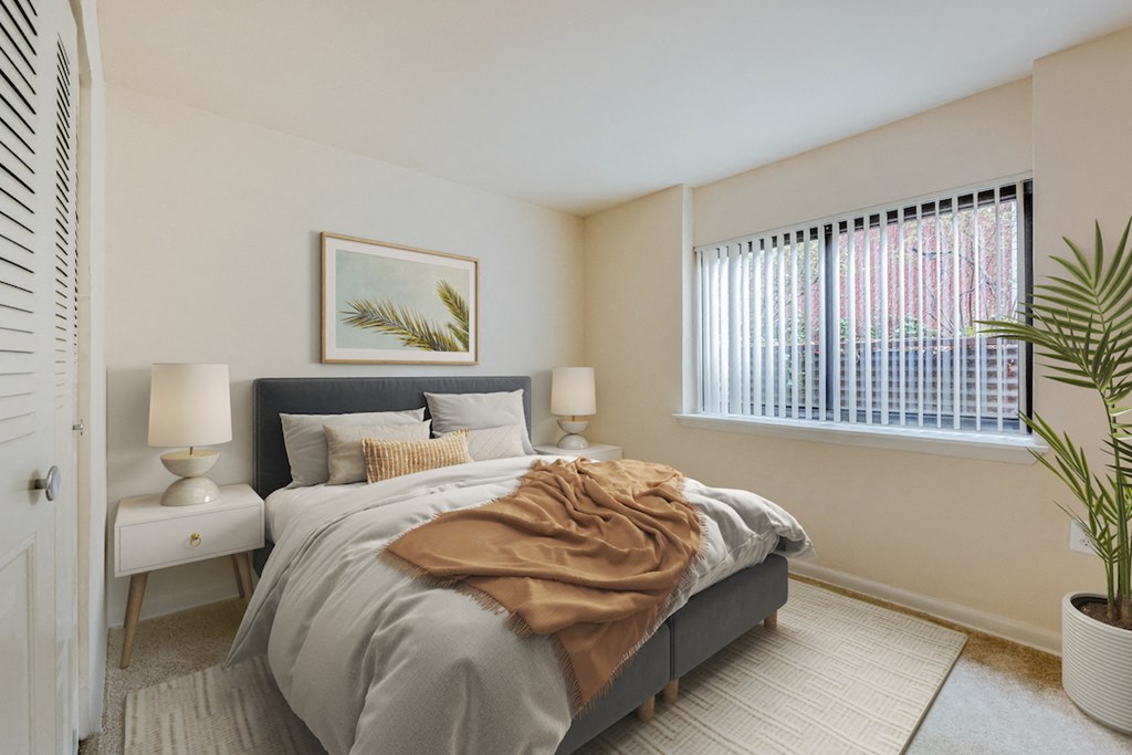 a bedroom with a bed and a window