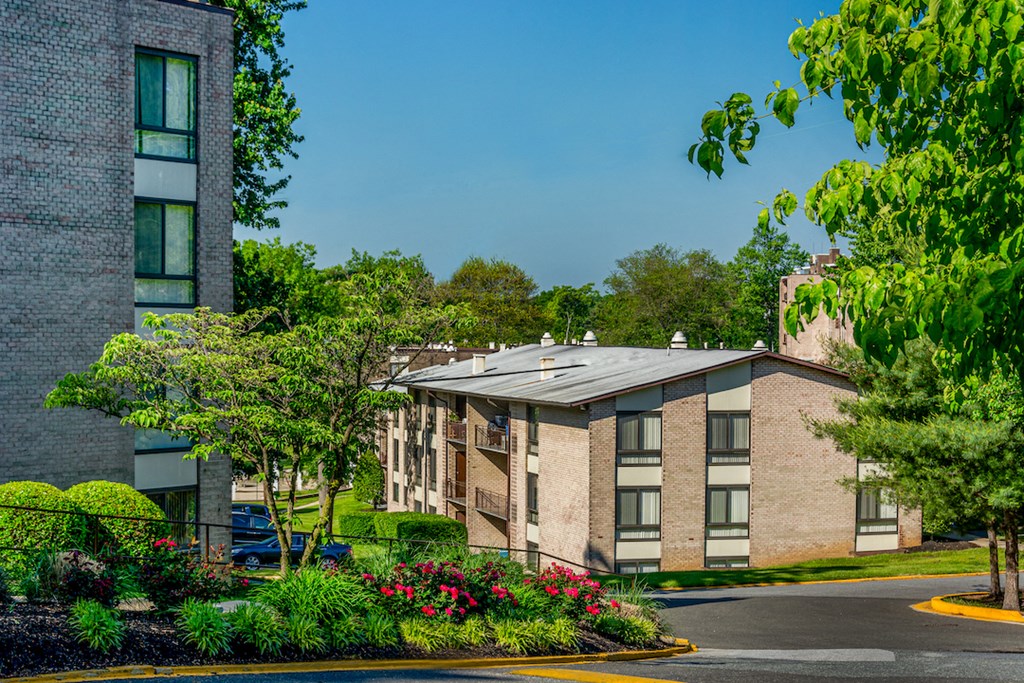 a brick building with a solar roof on the corner of a street